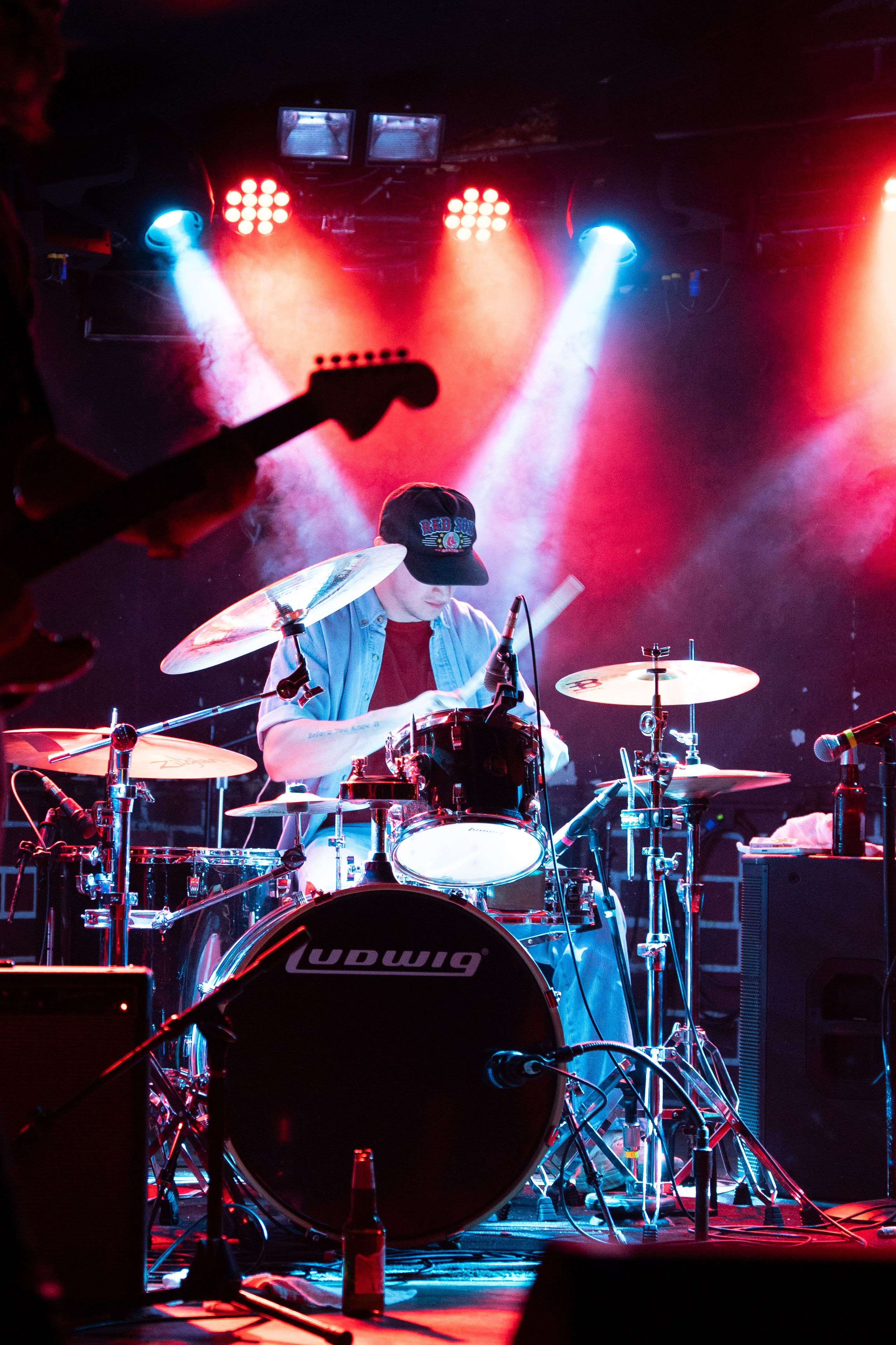 Singer kneeling at the edge of the stage.